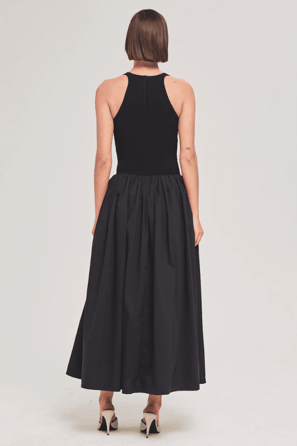 Sirinda Dress Black by Ronny Kobo – A trendy blend of modern romance and architectural elegance featuring a textured lace knit bodice and structured cotton skirt. Perfect for impactful evening events and special occasions.