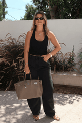 Bella Halter Tank Black by Sneaky Link – A chic, breathable cotton-spandex tank with a deep scoop neckline and open back, perfect for layering or solo wear.