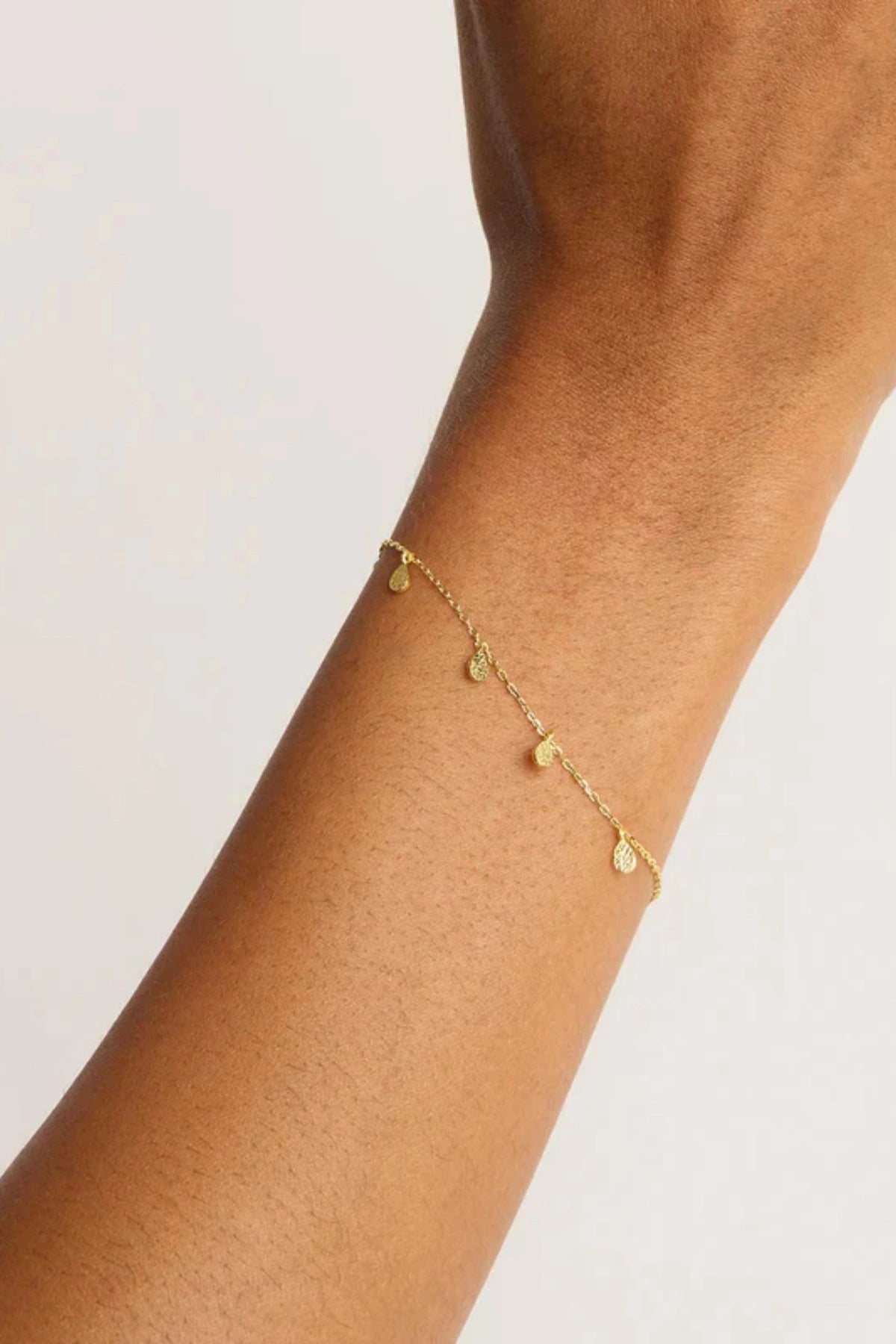 Grace Bracelet by By Charlotte, a gold vermeil bracelet with teardrop charms. Perfect for stacking or soulful everyday styling.