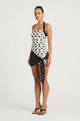 Marnie Mini Dress by Benni, black and white polka halter mini with straight neckline, ruched bodice and scarf wrap tie detail.