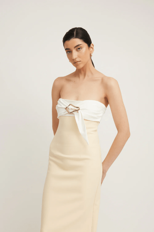 Kasai Dress Lemon/Ivory by Tojhà – A chic strapless maxi with structured bonded fabric, signature buckle detail, and princess seams, perfect for sophisticated events.