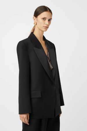 Natalini Blazer Black by Camilla and Marc – Elegant blazer crafted from luxurious Australian wool with sleek satin lapels, forward-rolling shoulders, and a raised swinging back hem.