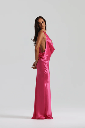 Gabi Gown Neon Pink by Natalie Rolt – A vibrant, bias-cut silk gown with dramatic open back and adjustable ties, perfect for making a trendy statement at special events.