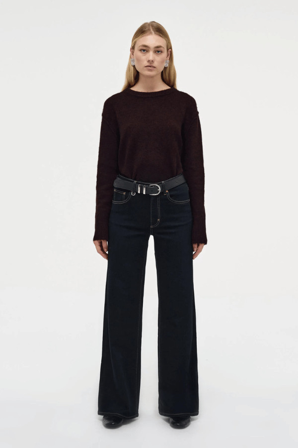 Eva Wide Cannes Dark Indigo by Neuw Denim, trendy tailored wide-leg jeans with a fitted mid-rise waist and A-line cut. Perfect for a feminine, laid-back look in dark indigo denim with subtle fading and contrast tobacco stitching.