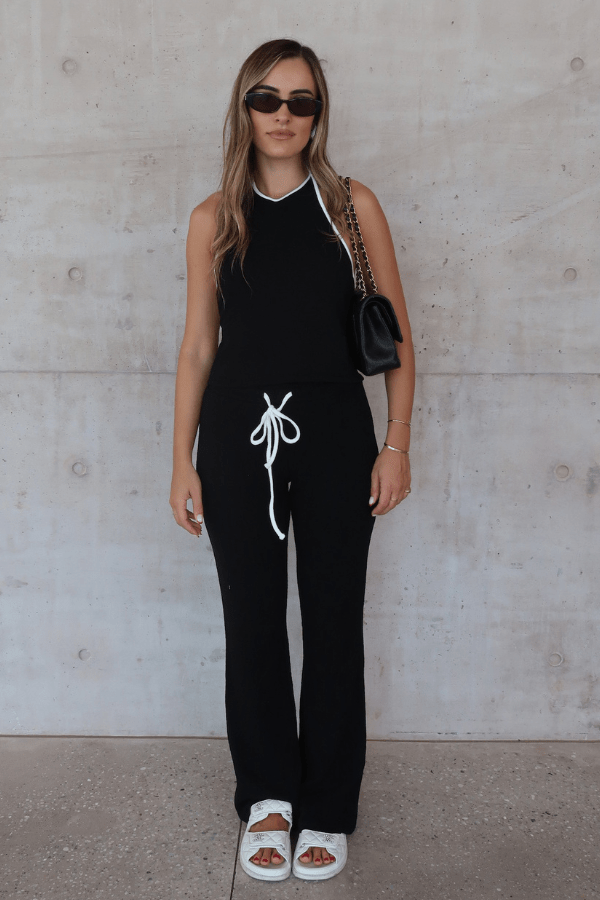 Charlie Halter Top Black/White by Sneaky Link - Trendy summer staple with chic halter neckline and open back. Perfect for beach days or viral nightlife vibes.