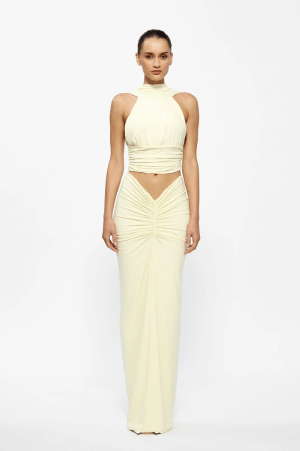 Cassidy Top Lemon by Effie Kats — A fitted, ruched silhouette crafted from soft stretch jersey for comfort and style. Perfect for layering or standalone wear.