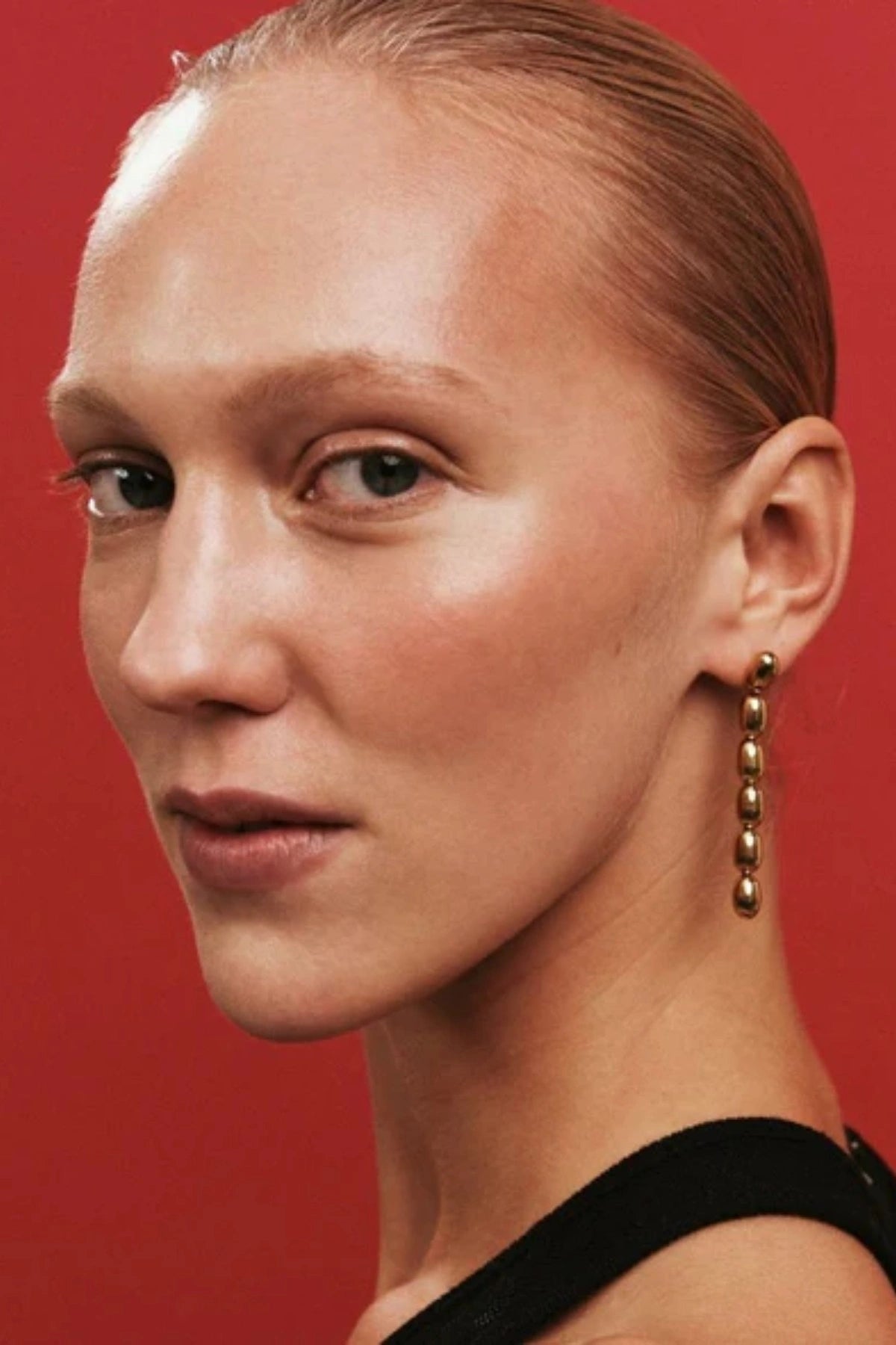 dith Earrings by Heaven Mayhem – gold twisted-bead drop earrings with sculptural movement and shine, perfect for refined everyday styling.