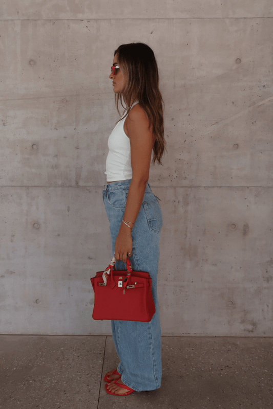 Bella Halter Tank White by Sneaky Link – Soft cotton-spandex blend with a deep scoop neckline, open back, and supportive halter design. Perfect for layering or solo wear.