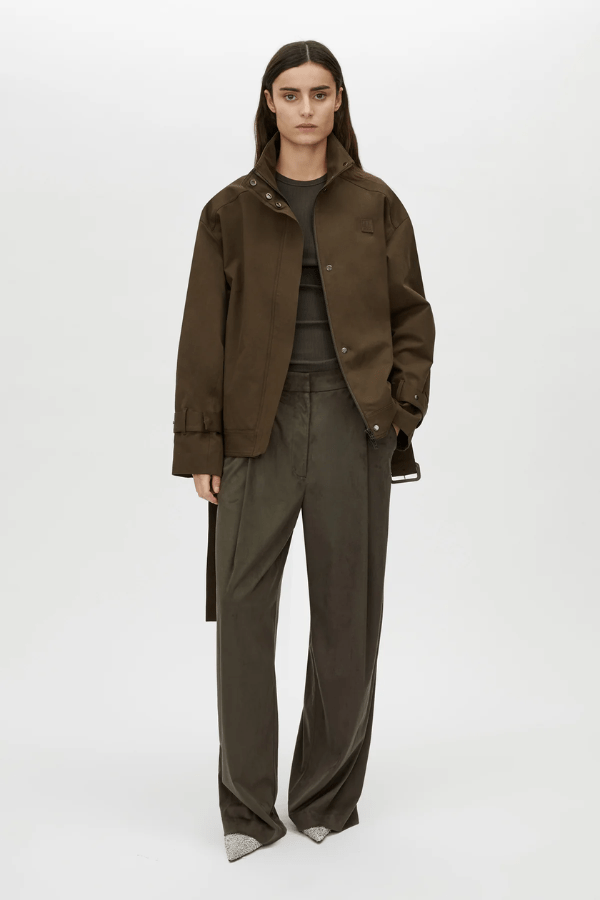 Tait Lounge Pant in Elm by Camilla and Marc, relaxed pant with deep pleats, slanted front pockets, back welt pockets, jigger button and hook-and-bar closure, crafted from 94% polyester and 6% elastane.
