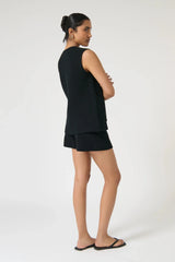 Onte Helena Shorts in black cotton crochet knit with elastic waistband, mini fit, styled with matching Helena Gilet.
