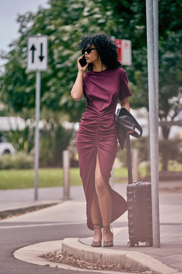 Niko Maxi Dress Burgundy by Pfeiffer – Trendy relaxed T-shirt maxi with adjustable side ruching, crew neck, and breathable cotton blend, perfect for elevated off-duty style and everyday comfort.
