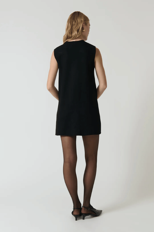 Nanda Dress Black by Onte – A Milano knit mini with gold buttons and A-line fit, designed for sleek, structured wear