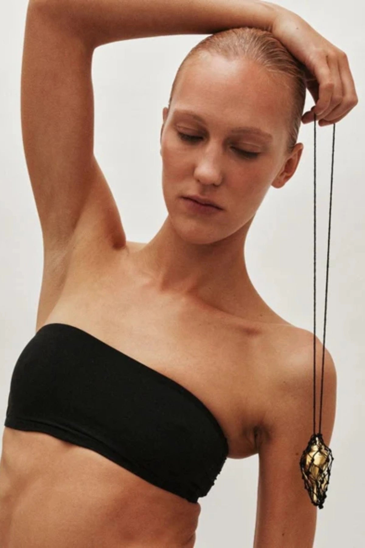 Sterling Necklace in Black/Gold by Heaven Mayhem – a black and gold knotted cord necklace with a sculptural shell pendant, perfect for bold modern styling.