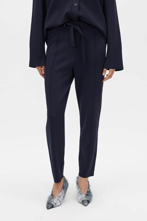 Lyndon Knit Pant Navy by Camilla and Marc, soft knit pant with slim leg, ribbed waistband with drawcords, and signature pin stitch detailing for a polished fit.