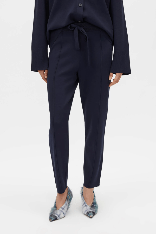 Lyndon Knit Pant Navy by Camilla and Marc, soft knit pant with slim leg, ribbed waistband with drawcords, and signature pin stitch detailing for a polished fit.