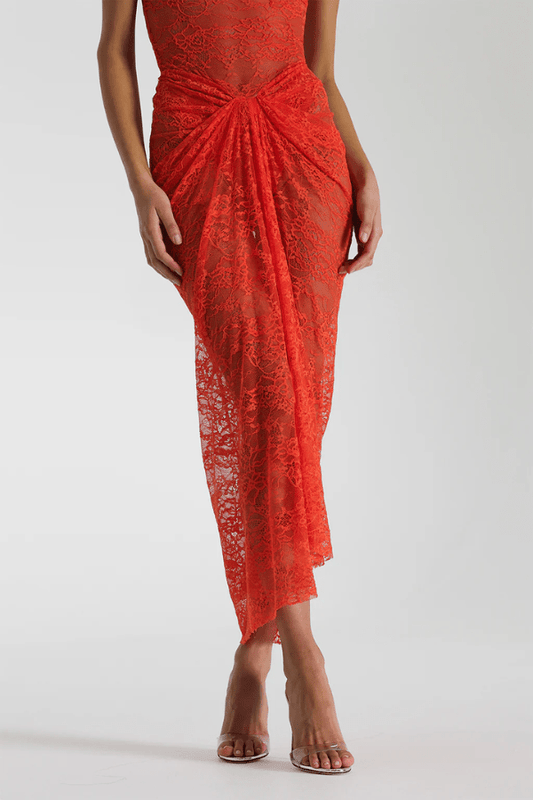 Naomi Dress Tangerine by Natalie Rolt – A strapless lace dress with ruched knot detail and soft draping, perfect for summer weddings, garden parties, or sunset soirées.
