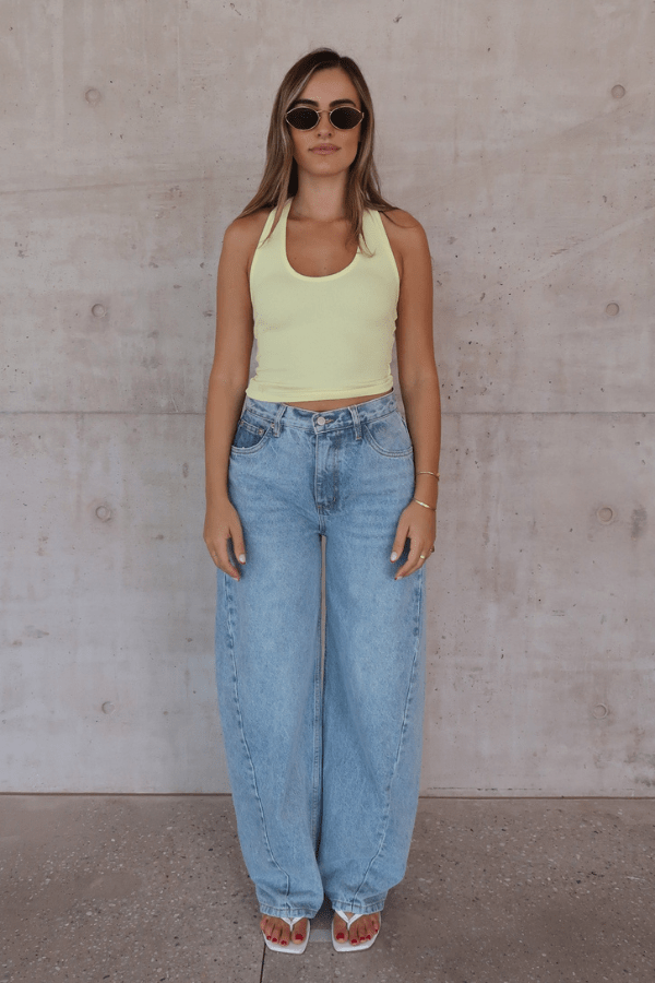 Bella Halter Tank Lemon by Sneaky Link – Soft cotton-spandex tank with deep scoop neckline and open back. A trendy, breathable piece for viral summer vibes.