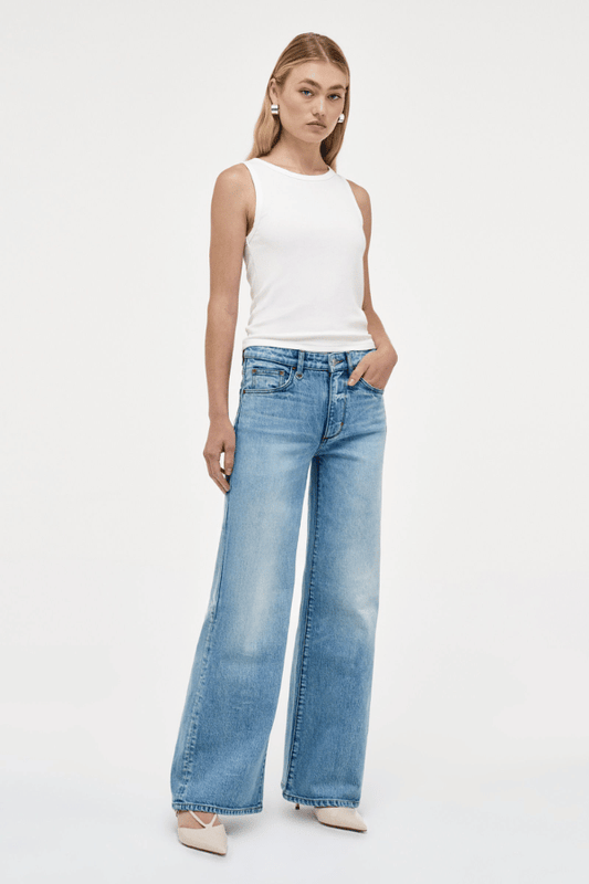 Eva Wide Arrival by Neuw Denim, trendy mid-rise jeans with a wide leg fit, crafted from cotton-rich denim. Perfect for a comfortable yet edgy look, featuring a classic button and zip fly with front and back pockets.