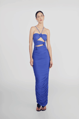 Veranera Marino by Maygel Coronel – A sculptural, ruched mesh maxi with asymmetric floral cut-outs and delicate rosebud straps, perfect for elegant evenings and resort wear.