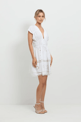 Sunrise Spirit Dress White by Pasduchas – A trendy, embroidered Tencel-linen blend dress with adjustable ties and scalloped hem, perfect for chic day-to-night occasions.