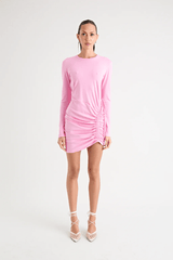 Rule Eight Dress Pink by Pfeiffer – A playful and polished cotton mini with adjustable side ruching, crew neckline, and full sleeves. Perfect for versatile day-to-night looks.
