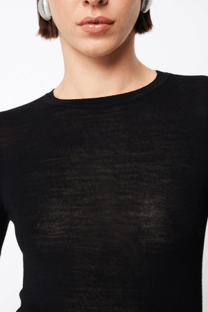 Maine Long Sleeve Top Black by Mossman – A viral, lightweight Merino wool essential with a sleek round neck and body-skimming fit, perfect for year-round layering or solo wear.