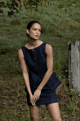 Good Vibes Top Indigo by Pasduchas – Trendy stretch denim with structured fit, gold snap studs, and mock pockets; perfect for chic, coordinated looks.