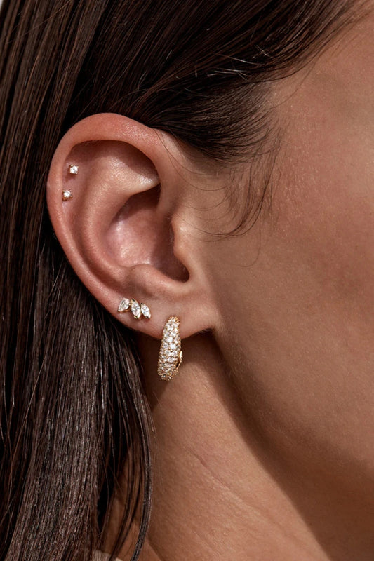 Crystal Wave Hoops by by charlotte — gold vermeil wave-shaped hoops with pavé crystals, perfect for elegant event styling.
