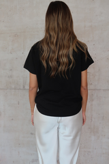 Black Tee by Sneaky Link – Trendy loose-fit 100% cotton classic black tee, a versatile essential for any capsule wardrobe and everyday casual looks.