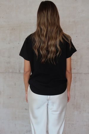 Black Tee by Sneaky Link – Trendy loose-fit 100% cotton classic black tee, a versatile essential for any capsule wardrobe and everyday casual looks.