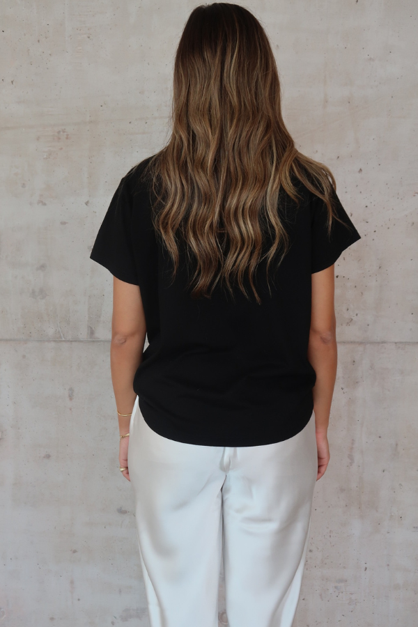 Black Tee by Sneaky Link – Trendy loose-fit 100% cotton classic black tee, a versatile essential for any capsule wardrobe and everyday casual looks.