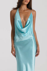 Gabi Gown in Turquoise by Natalie Rolt, handcrafted in Australia from 100% silk featuring an open back, draped neckline, and asymmetric silhouette.