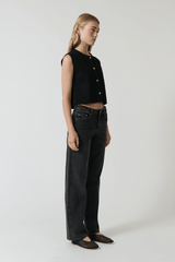 Linda Gilet Black by Onte – Trendy crochet-style knit gilet in breathable cotton with gold buttons and patch pockets, perfect for layering day-to-night.