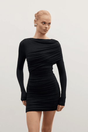 Kai Mini Dress Shadow by Bayse – Trendy ruched mini with asymmetric draped bodice, high boat neck, and bold deep V-back. Perfect for chic nights out and special events.