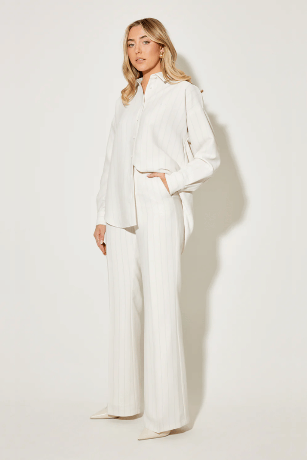 Ultimate Muse Pin Stripe Shirt Oat by Odd Muse — Classic pinstripe button-down with relaxed fit, breathable fabric, and OM embroidery for versatile, polished style.