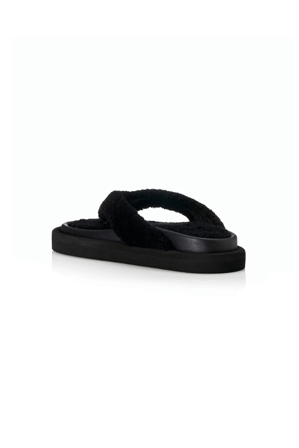 Ana Black Shearling by Alias Mae, elegant thong-style sandal crafted from 100% leather with a silver heart detail and 3.5cm heel. Size up if between sizes.