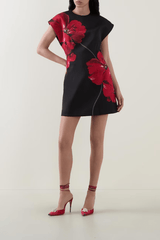 Chaya Mini Poppy Print Black Base by Rebecca Vallance – A trendy structured A-line mini with floral poppy print, round neckline, and dropped shoulders, perfect for special occasions or elevating everyday style with a polished, feminine touch.