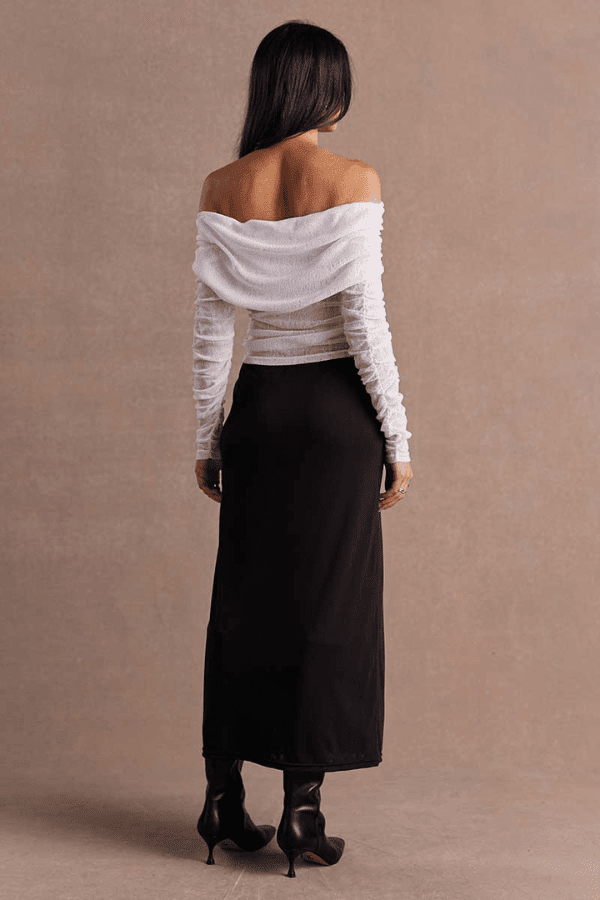 Emara Sleeveless Mini Dress Black by Sovere – fitted mini dress with pleats, keyhole neckline, tie details, and back zipper.