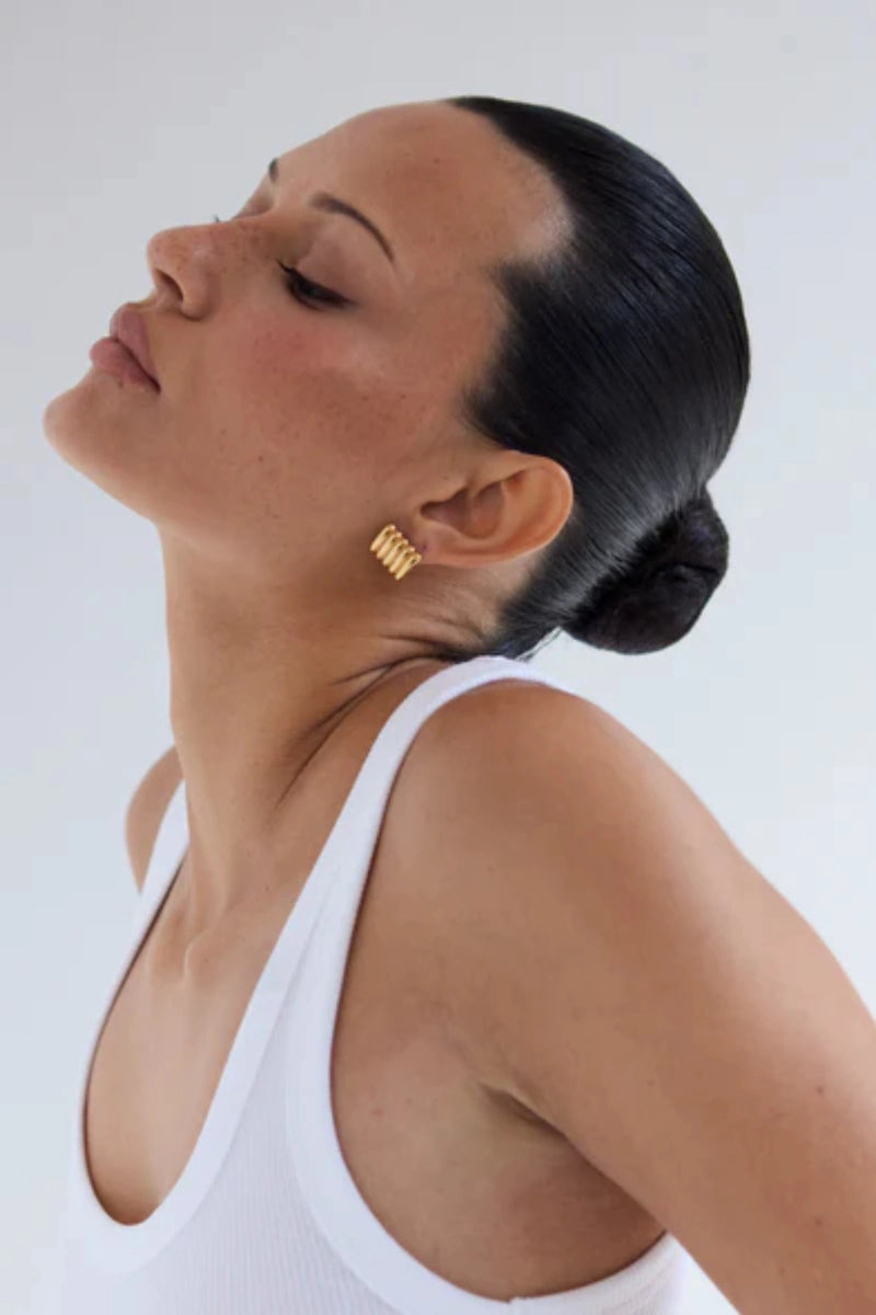 Clemmie Earrings by Heaven Mayhem, lightweight 18k gold-plated studs with ribbed texture. Perfect for everyday wear or layering.