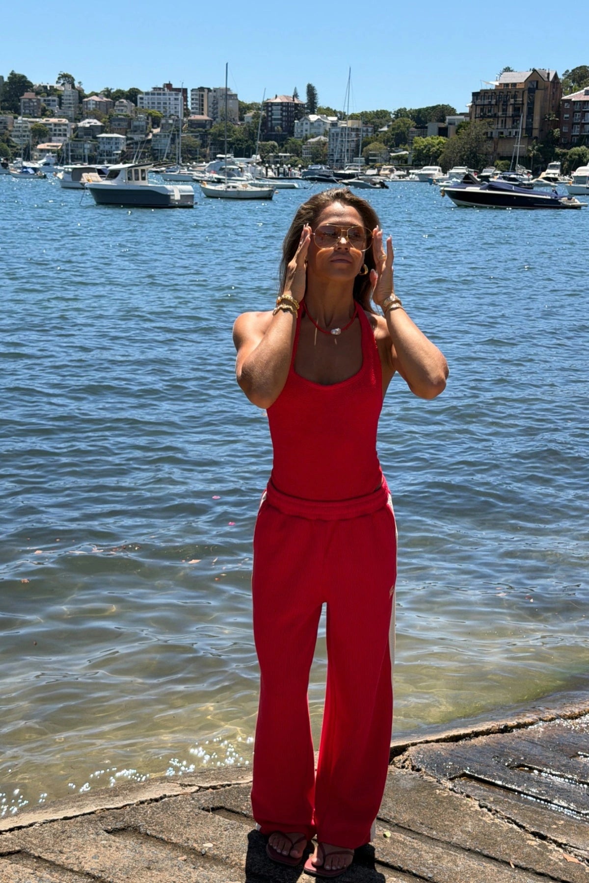Sandy Swim in Red by Hunza G, halterneck one-piece in sculpting seersucker crinkle fabric. Timeless, flattering, and vacation-ready.