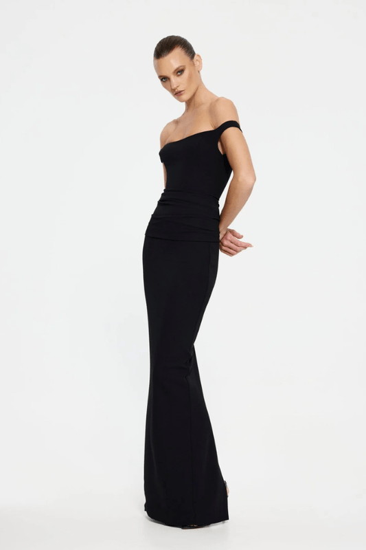 Hayward Gown Black by Effie Kats – An off-shoulder stretch-crepe gown with all-over ruching and a back split, perfect for black-tie events, red carpet moments, or evening galas.
