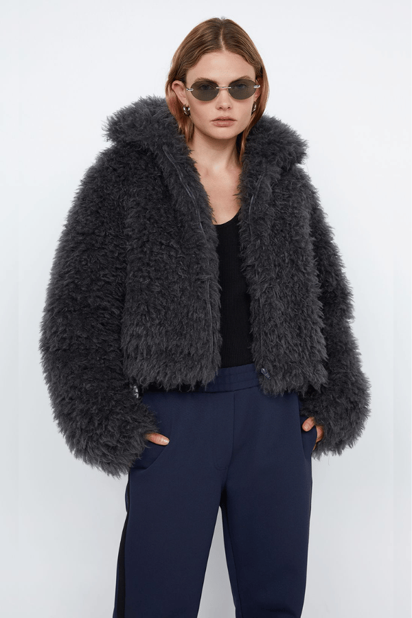 Argo Jacket Charcoal by Bec + Bridge – A chic charcoal faux fur bomber with wide collar, relaxed fit, front hook closure, and low waist finish. Fully lined. Dry clean only.