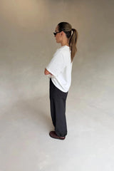 White Olivia High V Neck Relaxed Tee with short sleeves and a loose fit on a plain background.