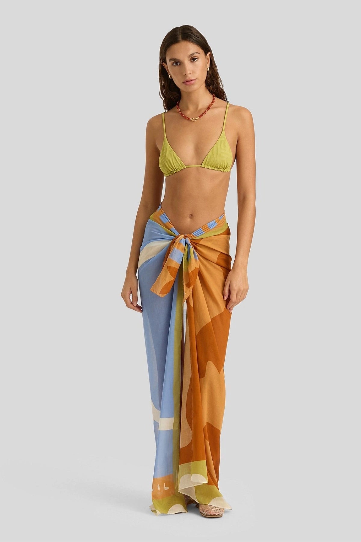 Square Pareo by Soleil Soleil, an organic cotton wrap with abstract Kin print. Perfect as a beach skirt, scarf, or resort layer.