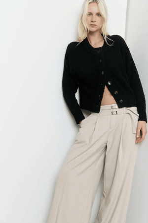Allure Cardigan Black by Sovere Studio – Breathable 100% cotton knit with crew neck, button front, dropped shoulders, and ribbed details. Relaxed fit, perfect for layering.