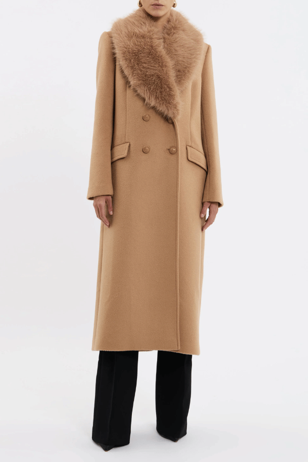Biera Coat Camel by Rebecca Vallance – Timeless boxy double-breasted wool coat with embossed dome buttons and removable faux fur trim. Features flap pockets, back vent, and full lining.
