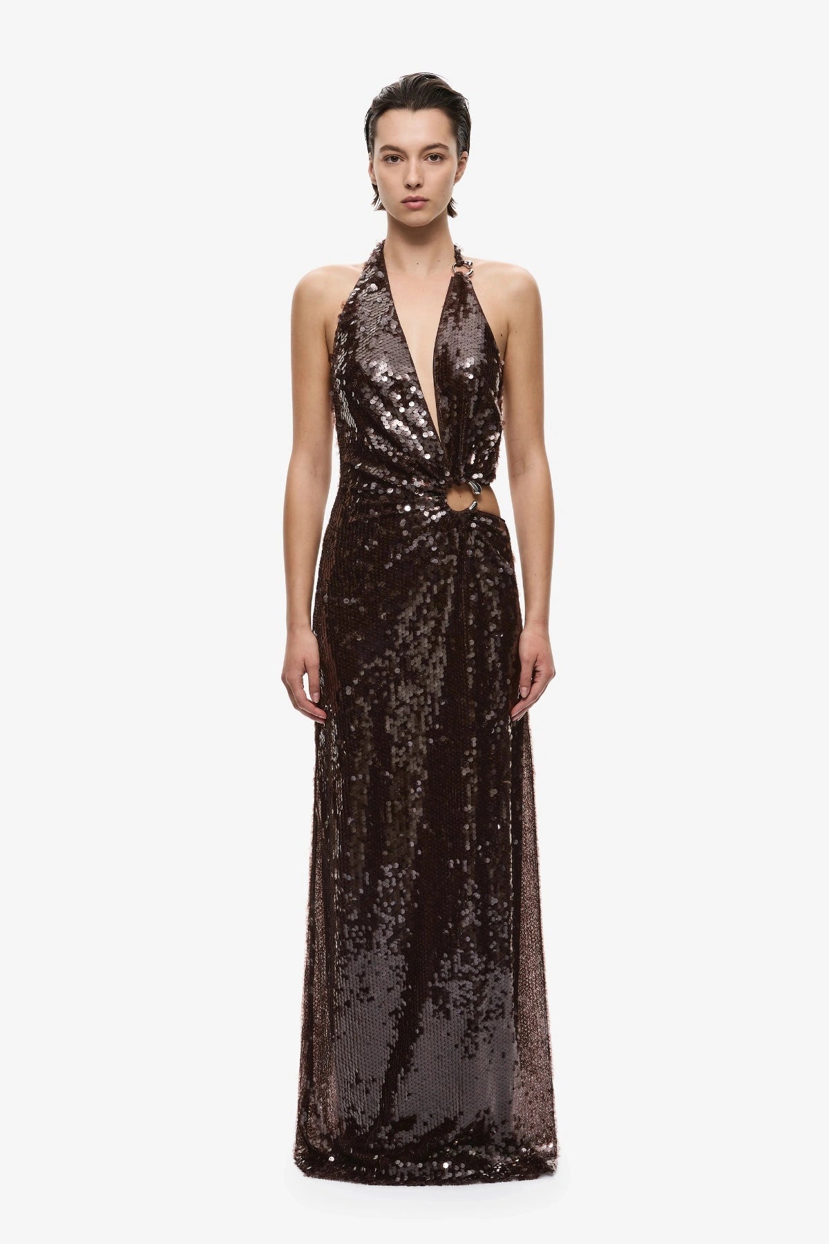 Devon Sequin Dress Chocolate by Misha, an asymmetric plunge sequin gown with metal ring details and an open back for dramatic evening wear.
