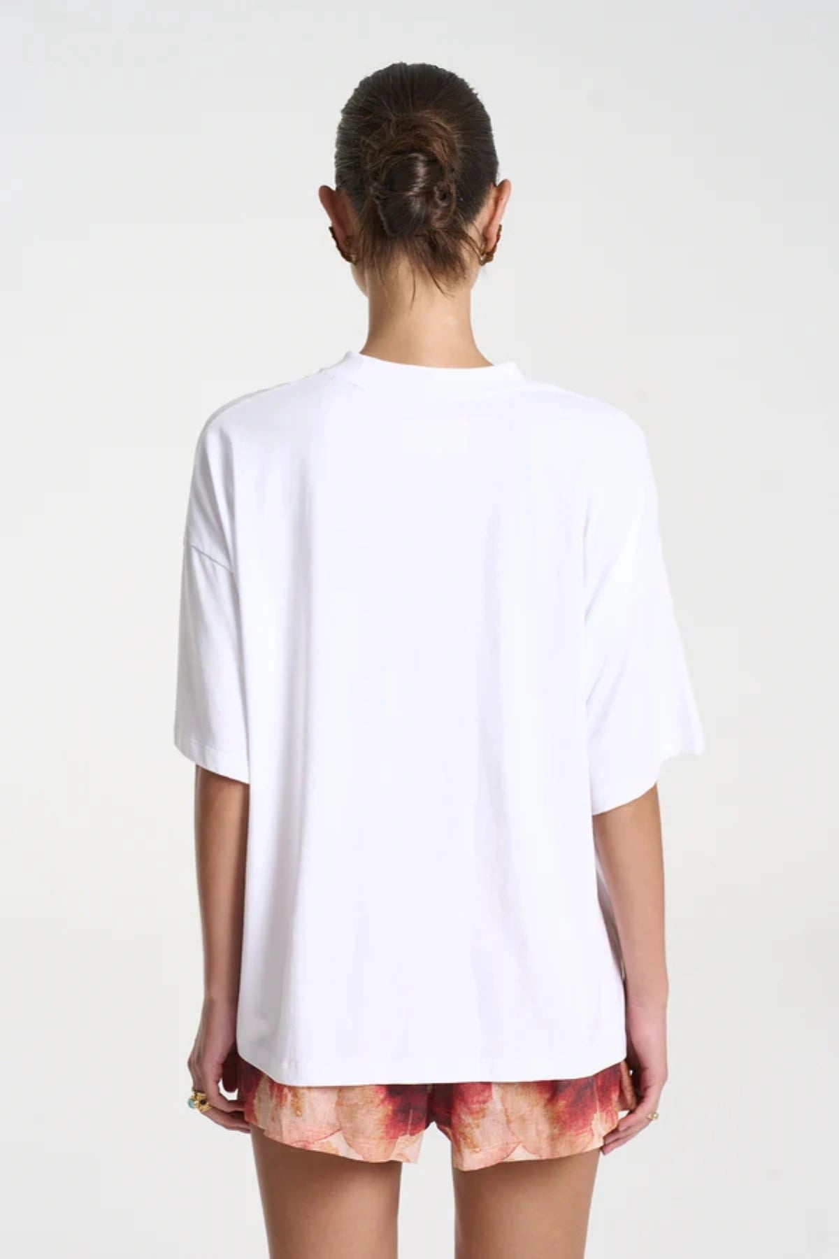 Aloha Tee by Summi Summi — a white cotton tee with a cropped boxy fit and hand-painted motifs, perfect for easy everyday styling.