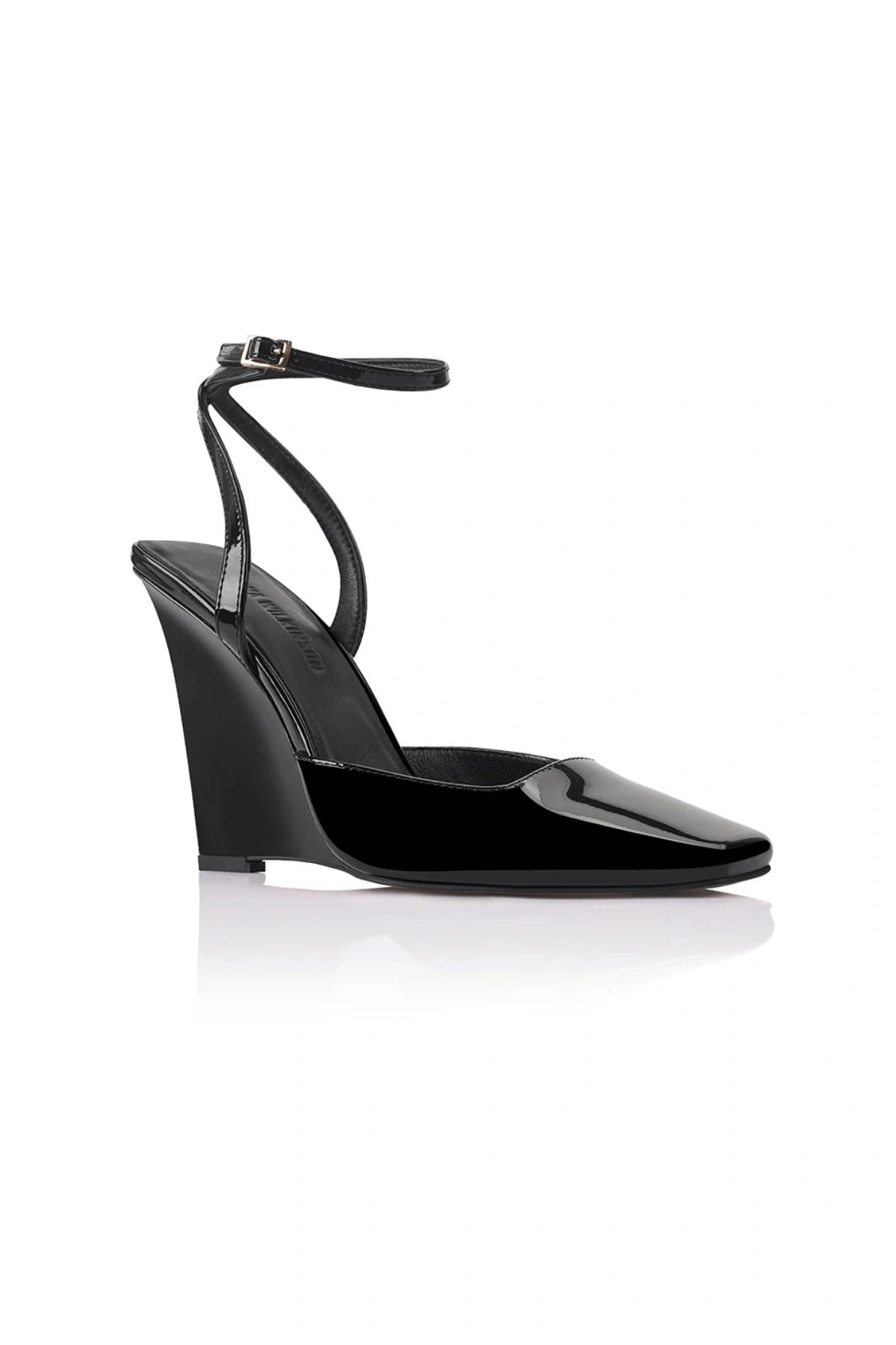 Lana Wilkinson Mona Wedge in black patent leather with pointed toe, high-cut vamp, ankle strap, and sculptural wedge heel.