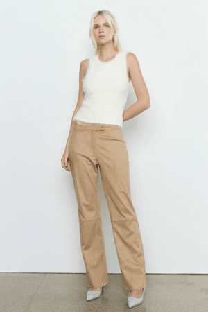 Sabado Combo Knit Cream by Sovere – Trendy two-piece knit set with a fluffy V-neck sweater and ribbed tank, perfect for layering in casual or chic looks.